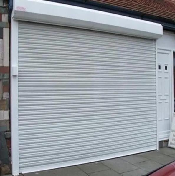 天津恒信电动门有限公司:卷帘门、电动卷帘门及电动车库门专业制造商